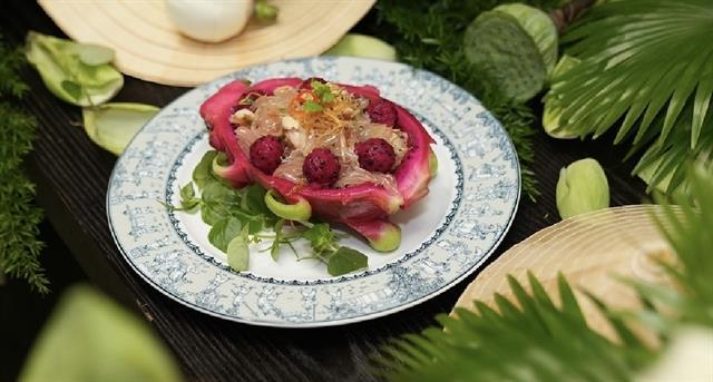 Green skin pomelo and red dragon fruit salad with fresh shrimp and dry squid