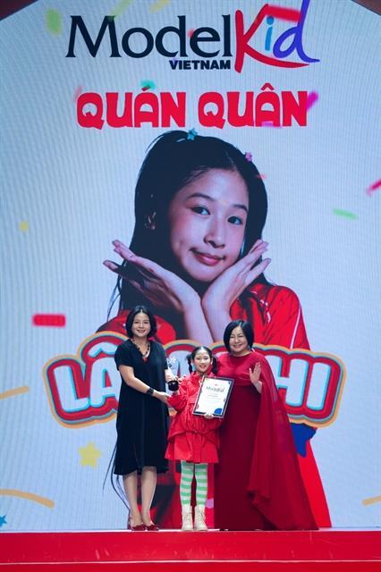 Young girl from Hà Nội wins modelling competition for kids