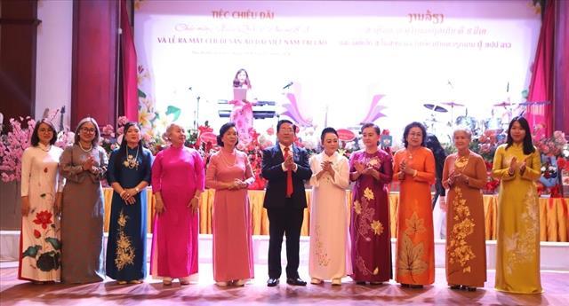 Club promoting Việt Nams áo dài tunic set up in Laos